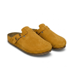 Premium Suede Boston Clogs | Comfortable Slip-On Sandals in Kampala Step into effortless style and unmatched everyday comfort with our premium Suede Boston Clogs. Crafted from high-quality soft suede leather featuring an adjustable metal pin buckle strap, these classic slip-on shoes deliver the ultimate blend of fashion and function. Designed with an ergonomic, supportive cork-latex footbed that molds to the shape of your feet over time, they provide exceptional arch support for all-day wear. Whether you are running errands around town, heading to a casual weekend meetup, or lounging at home, these versatile mules are a wardrobe essential. Key Features: Premium Suede Upper: Soft, durable, and breathable natural leather for a luxurious look and feel. Anatomical Cork Footbed: Contoured design distributes body weight evenly for superior joint and arch support. Adjustable Metal Buckle: Customizable strap for a secure, personalized fit. Lightweight EVA Outsole: Flexible, shock-absorbing soles designed for reliable traction on any surface. Product Details: Style: Closed-toe slip-on mule / Boston clog Colors Available: Classic Taupe, Warm Mustard Yellow, and Elegant Grey Sizes: Available in standard European (EU) sizing