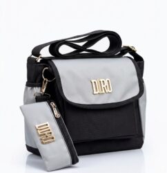 DIRO black and pink crossbody messenger bag with matching zippered pouch on plain white studio background